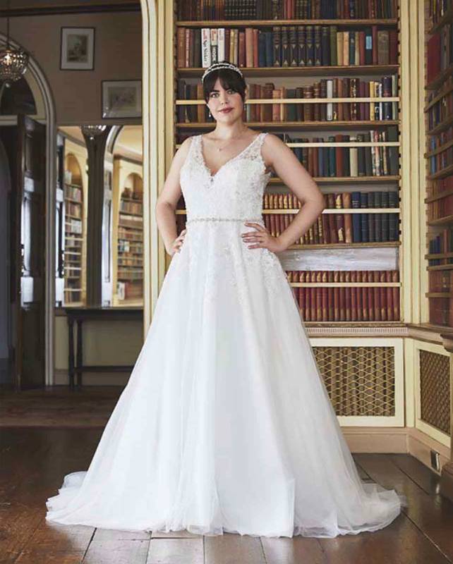 Full length view of white lace plus size wedding dress
